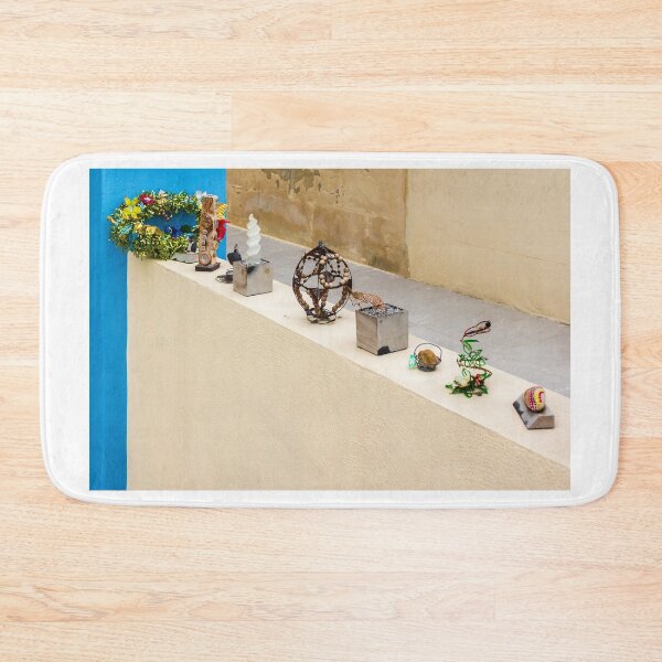 Item preview, Colorful Handmade Ornaments and Trinkets Displayed on Table Outside a Sunny Building designed and sold by Nmallia.
