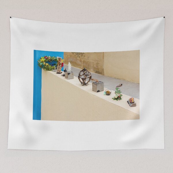 Item preview, Colorful Handmade Ornaments and Trinkets Displayed on Table Outside a Sunny Building designed and sold by Nmallia.