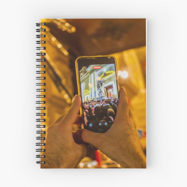 Item preview, Person Capturing Large Night Crowd At Decorative City Event On Smartphone With Festive Lighting And Architecture designed and sold by Nmallia.