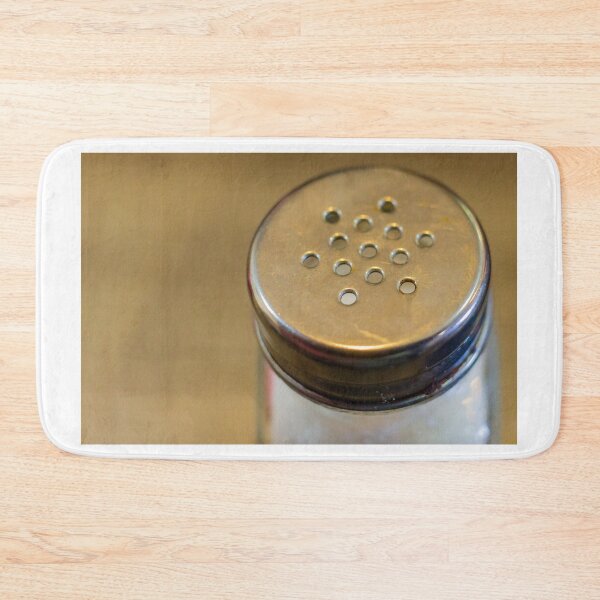 Item preview, Close-Up of Metal-Top Salt Shaker on Wooden Table for Dining and Seasoning designed and sold by Nmallia.