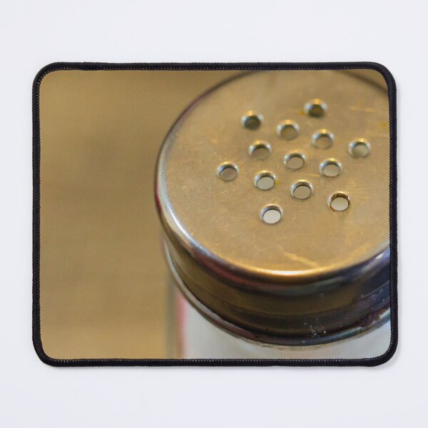 Item preview, Close-Up of Metal-Top Salt Shaker on Wooden Table for Dining and Seasoning designed and sold by Nmallia.