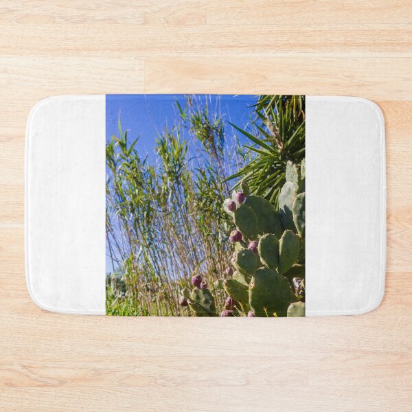 Item preview, Prickly Pear Cactus With Purple Fruit Under Clear Blue Sky Among Tall Grasses And Palm Leaves designed and sold by Nmallia.