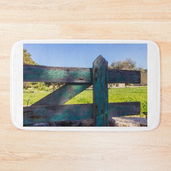 Item preview, Rustic Weathered Wooden Fence With Peeling Green Paint Overlooking Sunny Rural Field designed and sold by Nmallia.