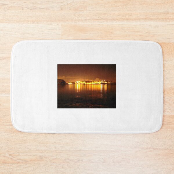 Item preview, Nighttime Harbor Cityscape With Golden Lights Reflected On Calm Waterfront designed and sold by Nmallia.