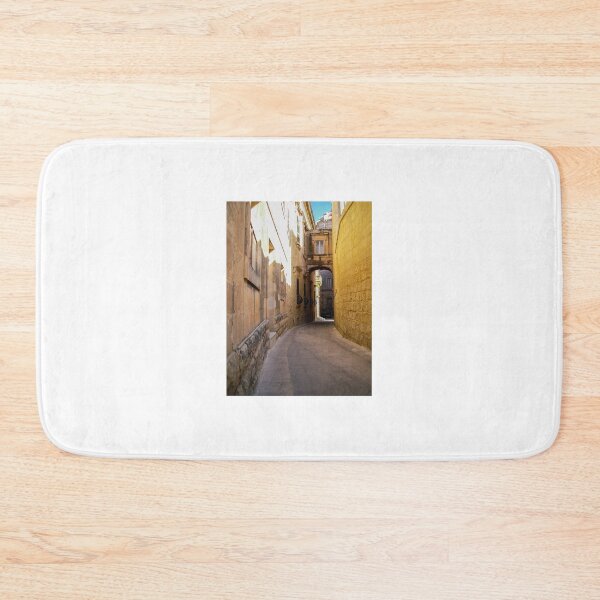 Item preview, Sunlit Narrow Stone Alleyway With Archway And Historic Mediterranean Architecture designed and sold by Nmallia.