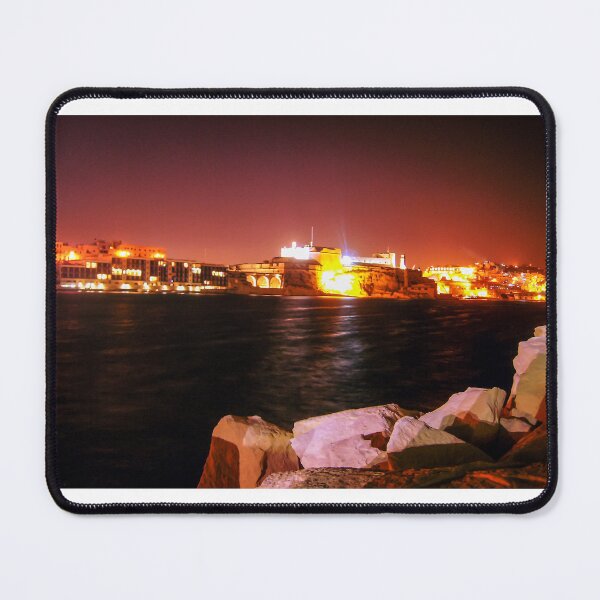Item preview, Illuminated Night Waterfront Fortress With Rocky Foreground and Long Exposure Reflections designed and sold by Nmallia.