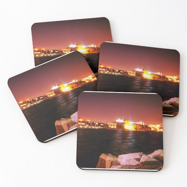 Item preview, Illuminated Night Waterfront Fortress With Rocky Foreground and Long Exposure Reflections designed and sold by Nmallia.