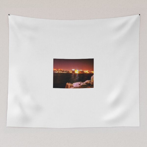 Item preview, Illuminated Night Waterfront Fortress With Rocky Foreground and Long Exposure Reflections designed and sold by Nmallia.