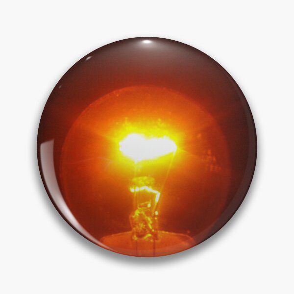 Item preview, Glowing Incandescent Light Bulb With Visible Filament Illuminating Warm Orange Light In Dark designed and sold by Nmallia.