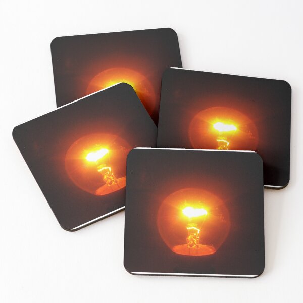 Item preview, Glowing Incandescent Light Bulb With Visible Filament Illuminating Warm Orange Light In Dark designed and sold by Nmallia.