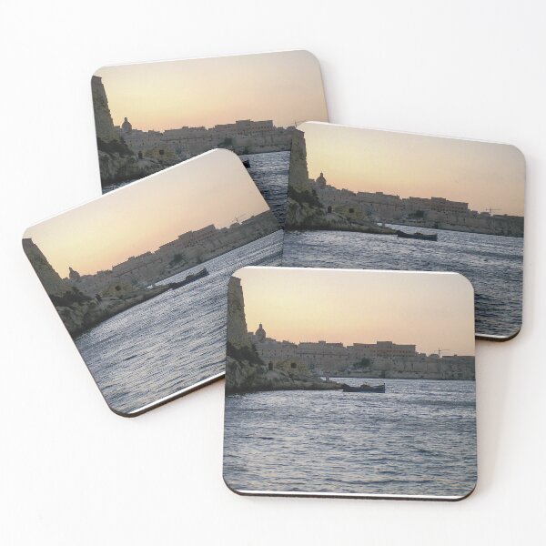 Item preview, Sunlit Stone Seawall With People Fishing Along Coastal Promenade At Golden Hour designed and sold by Nmallia.