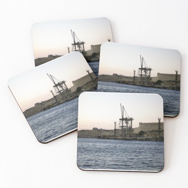 Item preview, Sunlit Stone Seawall With People Fishing Along Coastal Promenade At Golden Hour designed and sold by Nmallia.