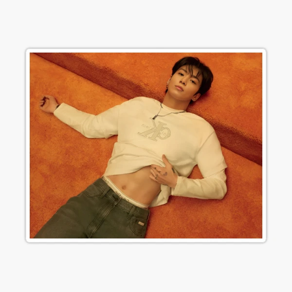 Jungkook of BTS lying down shows abs