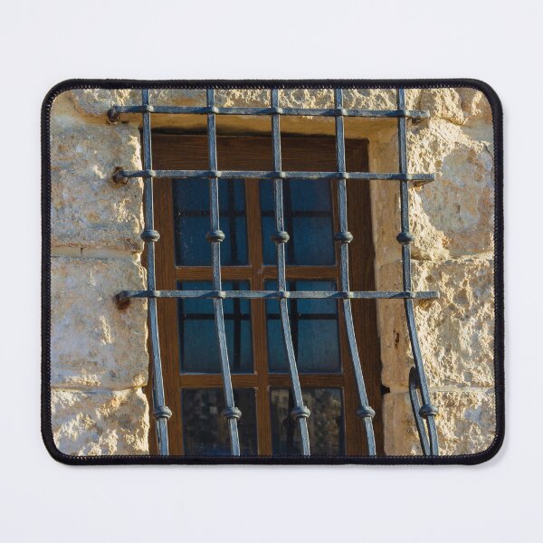 Item preview, Rustic Window With Iron Bars Set Into A Stone Wall, Sunlit Exterior Architectural Feature designed and sold by Nmallia.