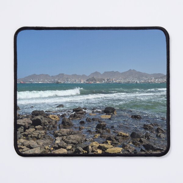 Item preview, Mindelo Coastline – Rocks, Waves, and Cityscape designed and sold by Felinephrame.