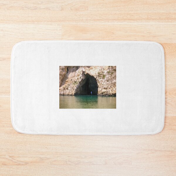 Item preview, Sea Cave Entrance in Limestone Cliff With Turquoise Water and Coastal Archway designed and sold by Nmallia.