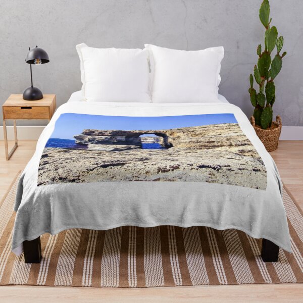 Item preview, Natural Sea Arch Rock Formation On Coastal Cliffs With Blue Mediterranean Sea And Clear Sky designed and sold by Nmallia.