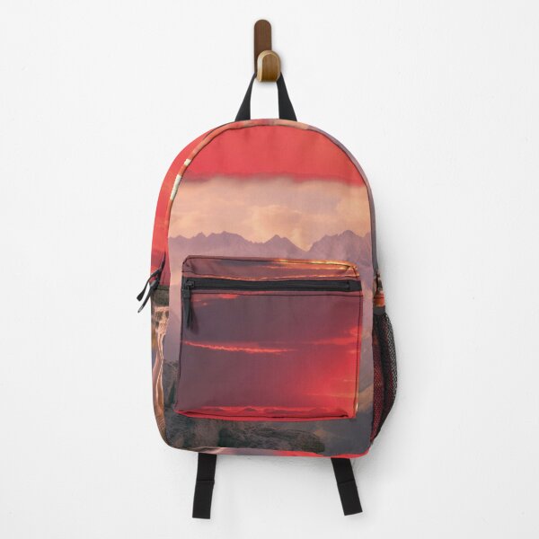 Item preview, Lone wolf on rocks against an alpenglow panorama designed and sold by Mauswohn.