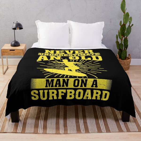 Item preview, Never Underestimate an Old Man on a Surfboard Surfing designed and sold by CosmoKitsch.