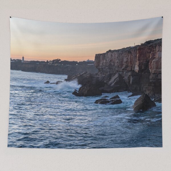 Item preview, Rough Coast at Sunset - the Sea Cliffs and Farol da Guia Lighthouse in Cascais Lisbon Portugal designed and sold by Georgia Mizuleva.