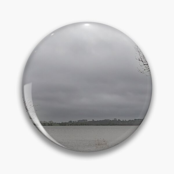 Item preview, Lonely Rowing boat On Shore Of Overcast Lough Under Gray Winter Sky designed and sold by ivon55.