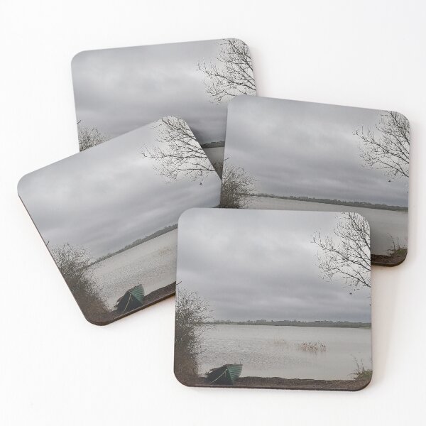 Item preview, Lonely Rowing boat On Shore Of Overcast Lough Under Gray Winter Sky designed and sold by ivon55.