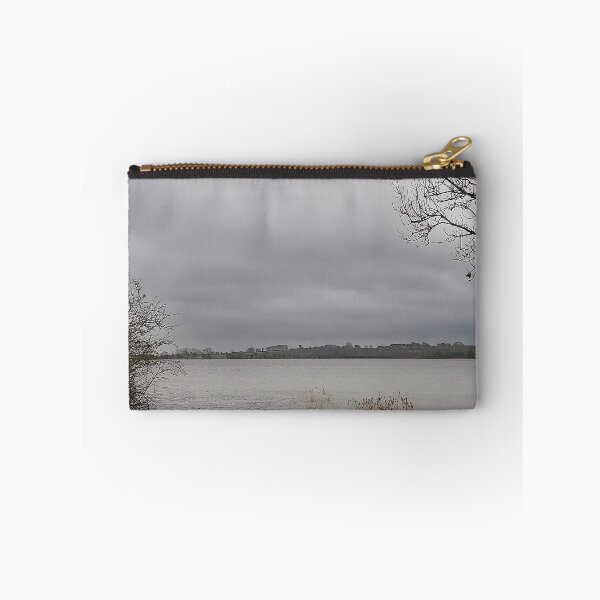 Item preview, Lonely Rowing boat On Shore Of Overcast Lough Under Gray Winter Sky designed and sold by ivon55.