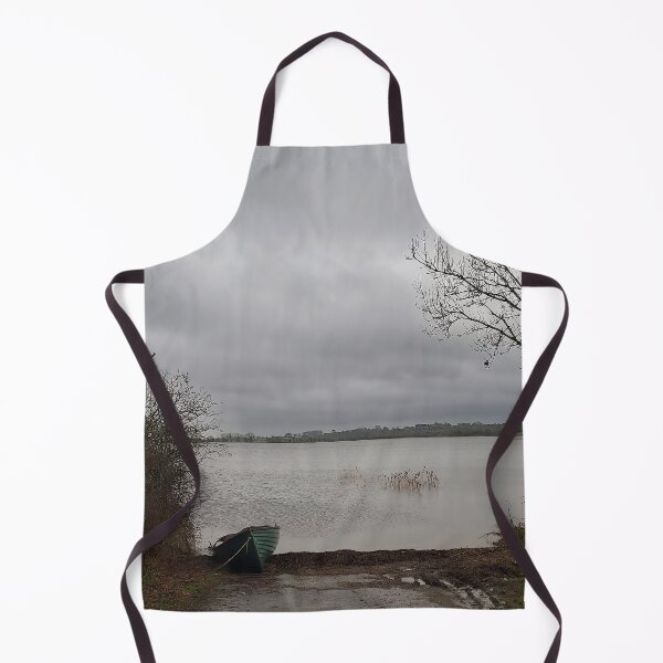 Item preview, Lonely Rowing boat On Shore Of Overcast Lough Under Gray Winter Sky designed and sold by ivon55.