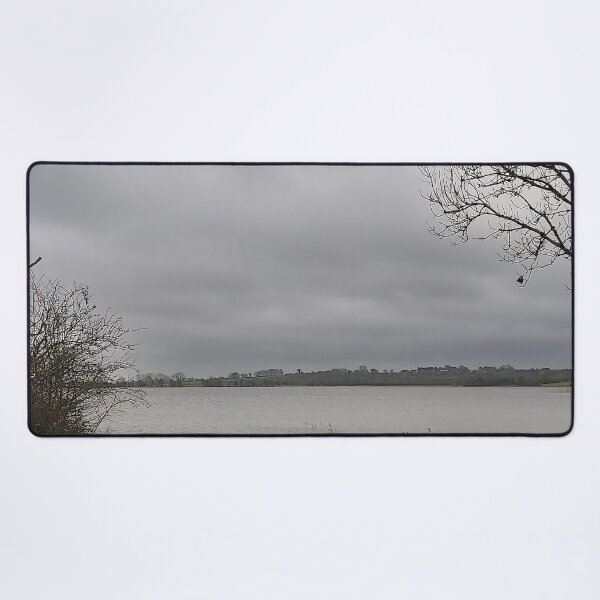 Item preview, Lonely Rowing boat On Shore Of Overcast Lough Under Gray Winter Sky designed and sold by ivon55.