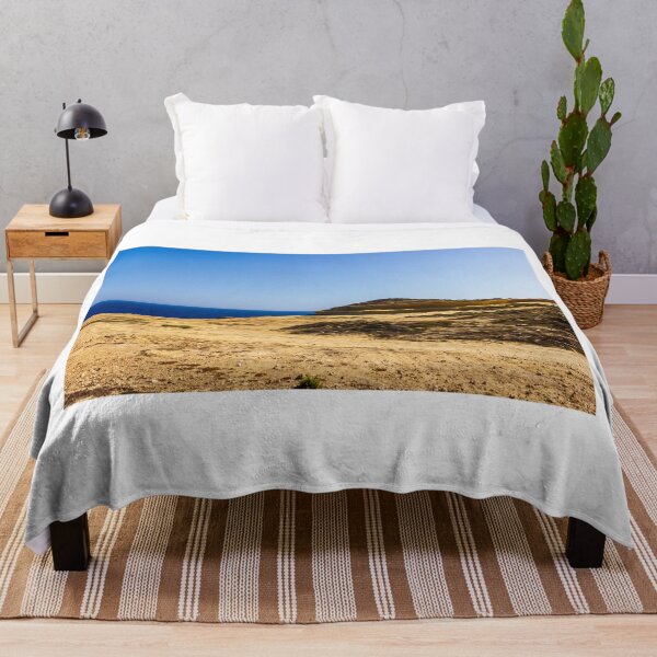 Item preview, Sunny Coastal Cliff Overlooking Deep Blue Sea With Sandy Rocky Shoreline And Clear Sky designed and sold by Nmallia.
