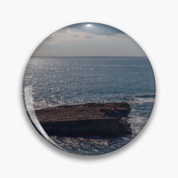 Item preview, Flat Coastal Rock Platform in Open Ocean Under Dramatic Cloudy Sky With Sunlit Water designed and sold by Nmallia.