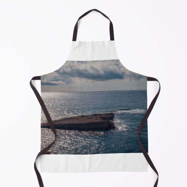 Item preview, Flat Coastal Rock Platform in Open Ocean Under Dramatic Cloudy Sky With Sunlit Water designed and sold by Nmallia.