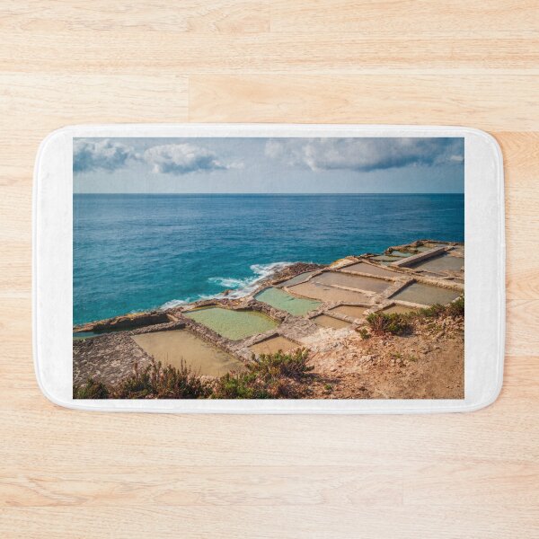 Item preview, Traditional Rocky Salt Pans Along a Turquoise Sea Coastline With Calm Waves and Cloudy Sky designed and sold by Nmallia.