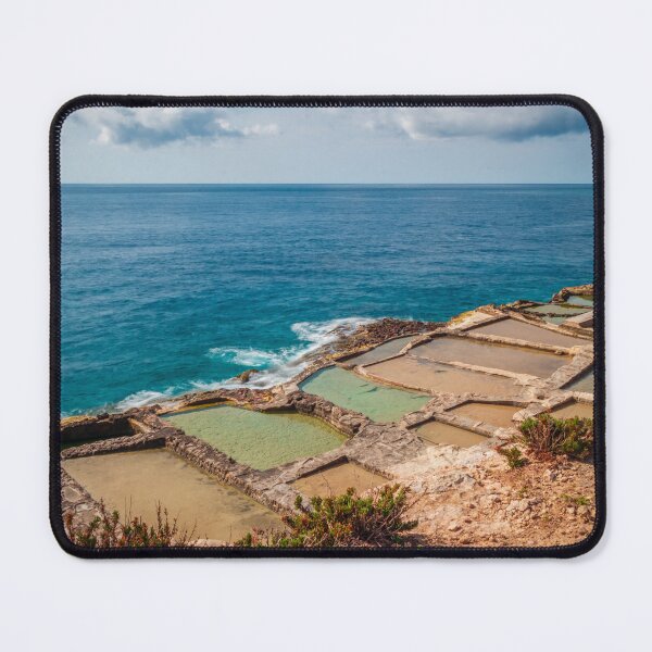 Item preview, Traditional Rocky Salt Pans Along a Turquoise Sea Coastline With Calm Waves and Cloudy Sky designed and sold by Nmallia.