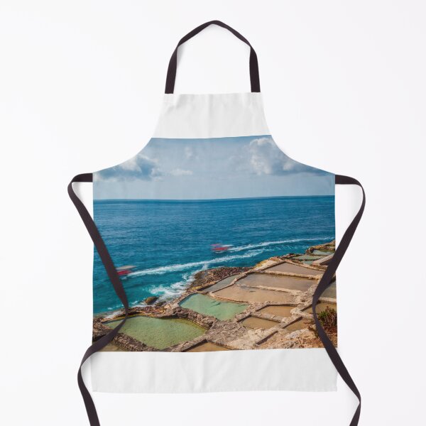 Item preview, Coastal Salt Pans Along Turquoise Sea With Boats and Rocky Cliffs Under Cloudy Sky designed and sold by Nmallia.