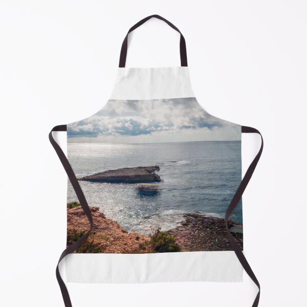 Item preview, Sunlit Rocky Coastline and Small Offshore Island With Calm Ocean Under Cloudy Sky designed and sold by Nmallia.