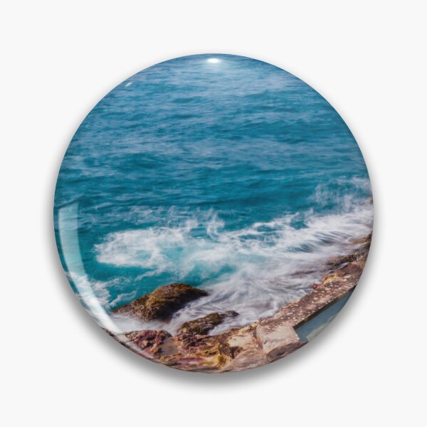 Item preview, Ocean Waves Crashing Over Rocky Coastline and Natural Rock Pools With Blurred Jet Ski in Distance designed and sold by Nmallia.