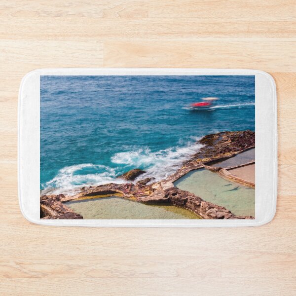 Item preview, Ocean Waves Crashing Over Rocky Coastline and Natural Rock Pools With Blurred Jet Ski in Distance designed and sold by Nmallia.