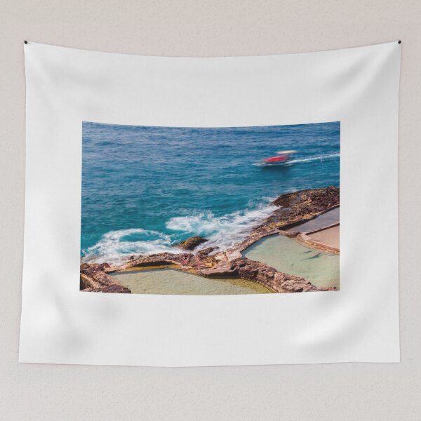 Item preview, Ocean Waves Crashing Over Rocky Coastline and Natural Rock Pools With Blurred Jet Ski in Distance designed and sold by Nmallia.