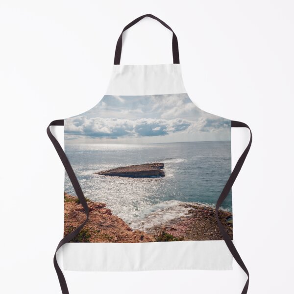 Item preview, Sunlit Rocky Coastline and Small Offshore Island Under Cloudy Sky Over Calm Blue Ocean designed and sold by Nmallia.