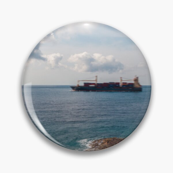 Item preview, Container Ship Passing Offshore Above Coastal Salt Pans Under Blue Sky And Clouds designed and sold by Nmallia.