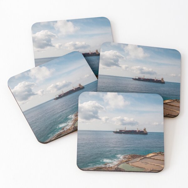 Item preview, Container Ship Passing Offshore Above Coastal Salt Pans Under Blue Sky And Clouds designed and sold by Nmallia.