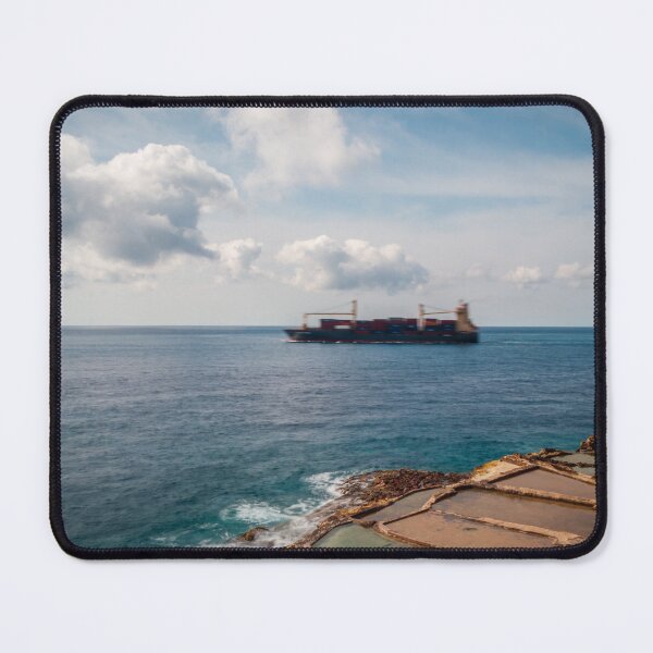 Item preview, Container Ship Passing Offshore Above Coastal Salt Pans Under Blue Sky And Clouds designed and sold by Nmallia.
