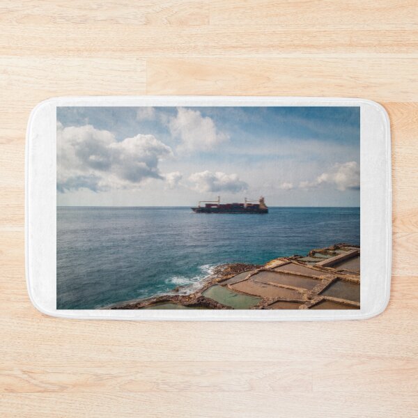 Item preview, Container Ship Passing Offshore Above Coastal Salt Pans Under Blue Sky And Clouds designed and sold by Nmallia.