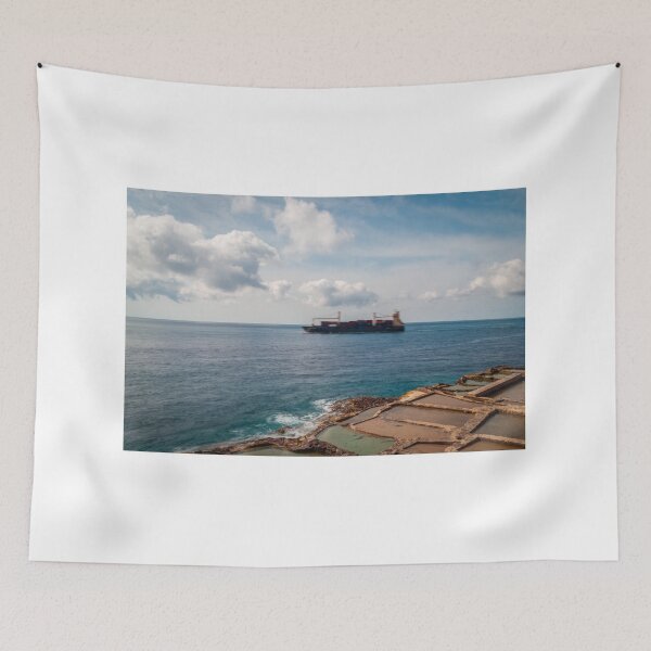 Item preview, Container Ship Passing Offshore Above Coastal Salt Pans Under Blue Sky And Clouds designed and sold by Nmallia.