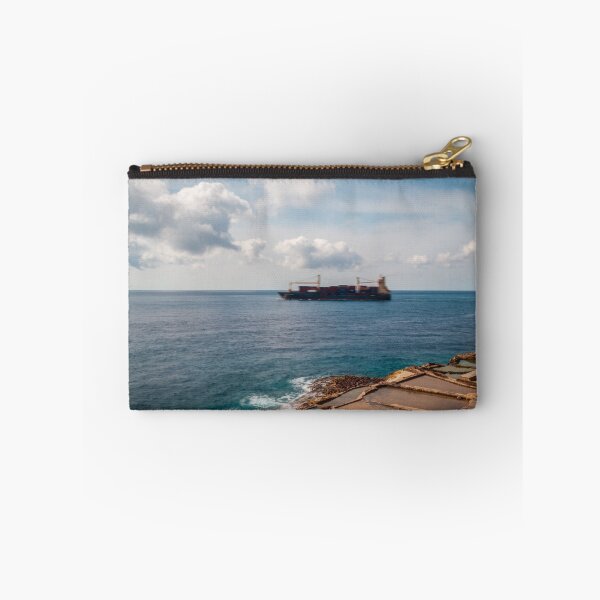 Item preview, Container Ship Passing Offshore Above Coastal Salt Pans Under Blue Sky And Clouds designed and sold by Nmallia.