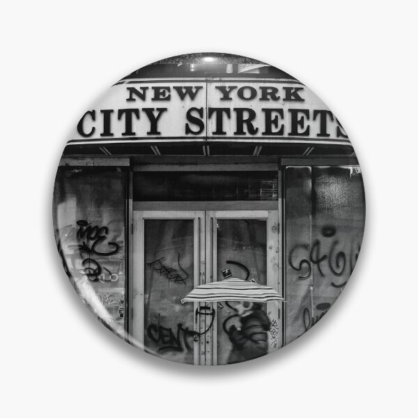 Item preview, New York city streets, woman with an umbrella next to a dilapidated storefront black and white vintage photograph poster art print designed and sold by Astrid Arkhangelsky.
