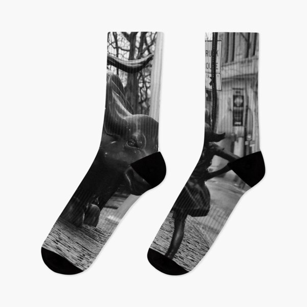 Item preview, Fearless Girl facing down the Charging Bull statue of Wall Street black and white photography poster art print designed and sold by Astrid Arkhangelsky.