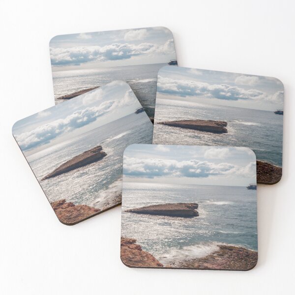 Item preview, Rocky Coastline Overlooking Calm Sea With Cargo Ship on Horizon and Sunlit Waves designed and sold by Nmallia.