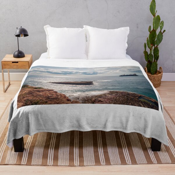 Item preview, Rocky Coastline Overlooking Calm Sea With Cargo Ship on Horizon and Sunlit Waves designed and sold by Nmallia.